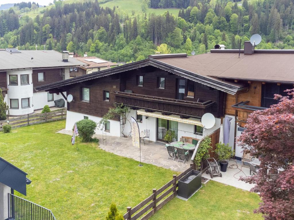 an aerial view of a house with a yard at Familien Lodge Fleckalm in Kirchberg in Tirol