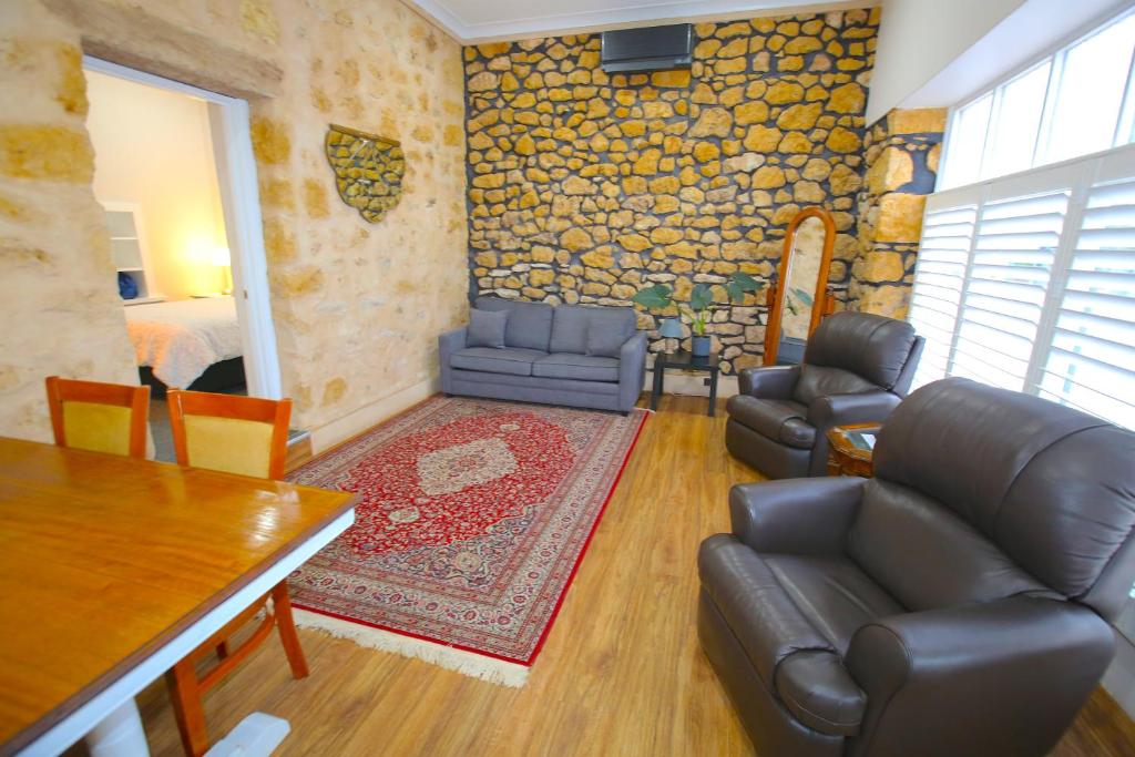 a living room with a couch and chairs and a table at Villa Firestone, formally Harbour Mannum in Mannum