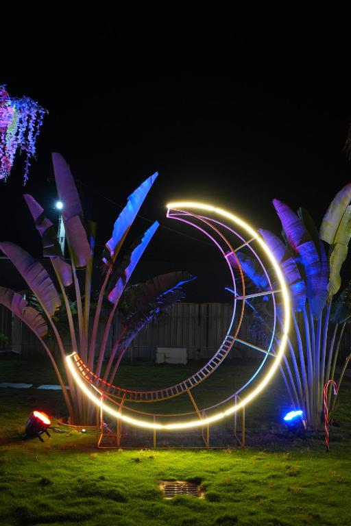 a park with a roller coaster at night at Eden Park Resorts in Vuyyūru