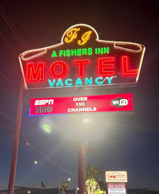 a neon sign for a morrisemen inmoetzona at A Fisher's Inn Motel in Las Vegas