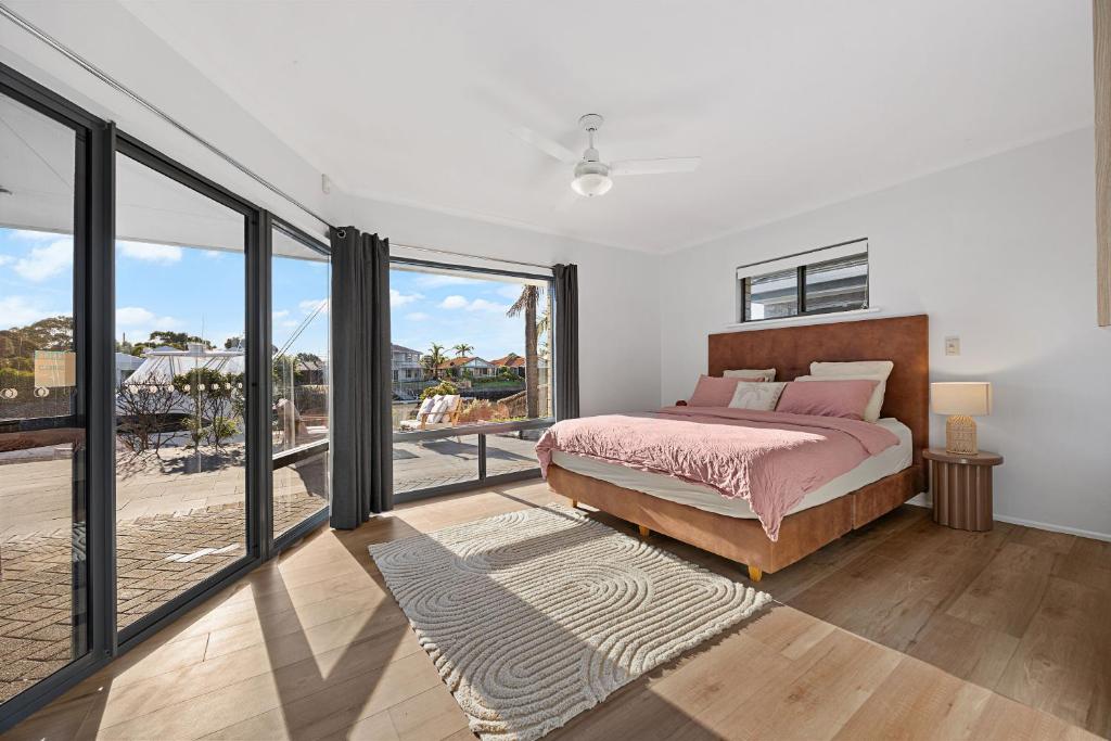 a bedroom with a bed and a large window at Smada Stay - 4BR, Waterfront, Perfect Entertainer in Port Lincoln