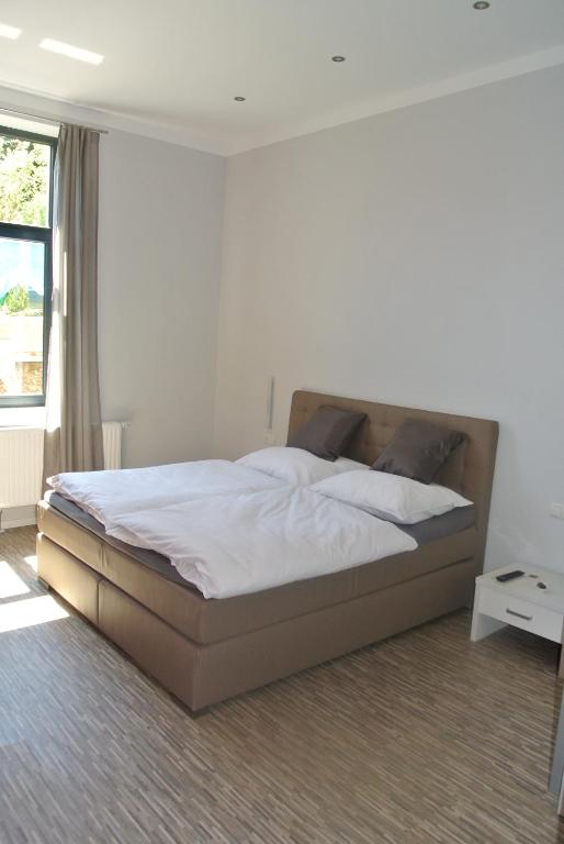Postel nebo postele na pokoji v ubytování Gästehaus Tappes Hofgarten