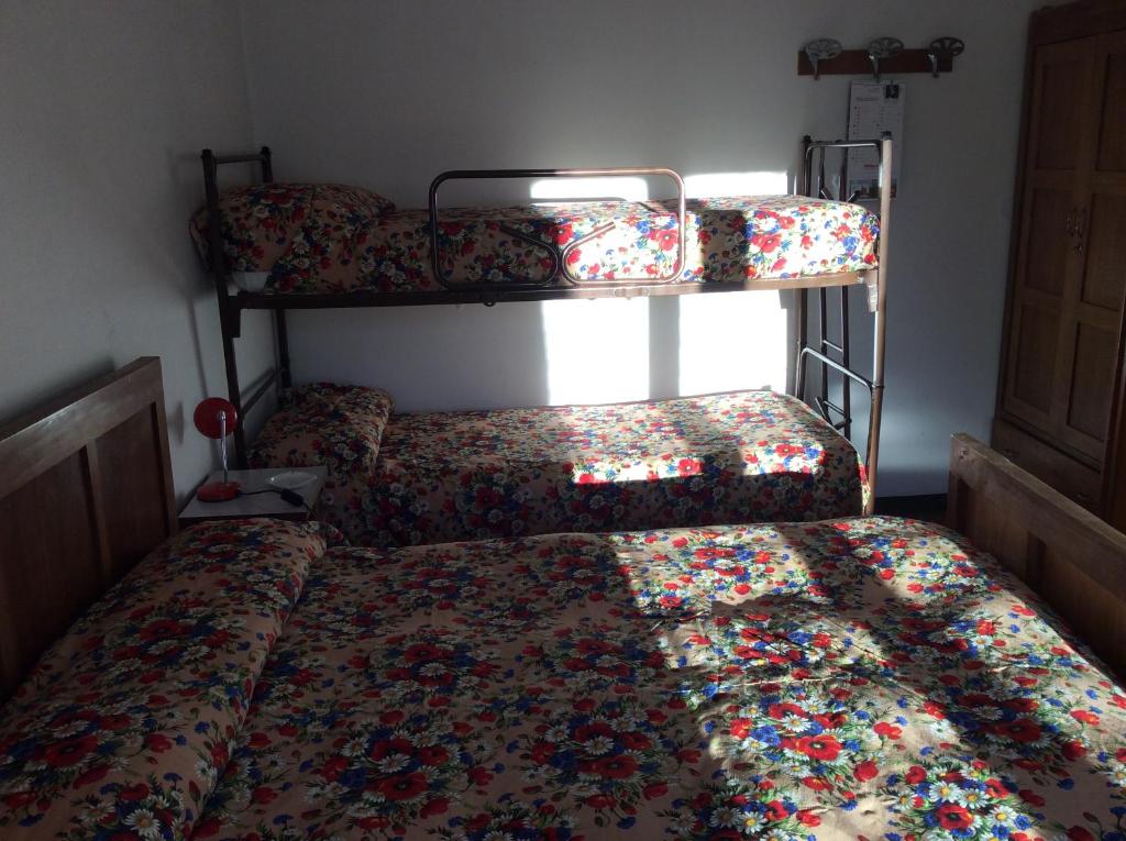 Postel nebo postele na pokoji v ubytování Albergo Cervo