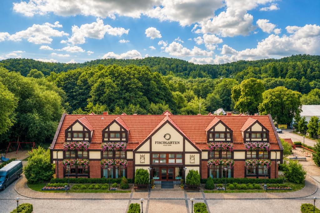 an aerial view of a building with trees at Dom Oliwski in Gdańsk