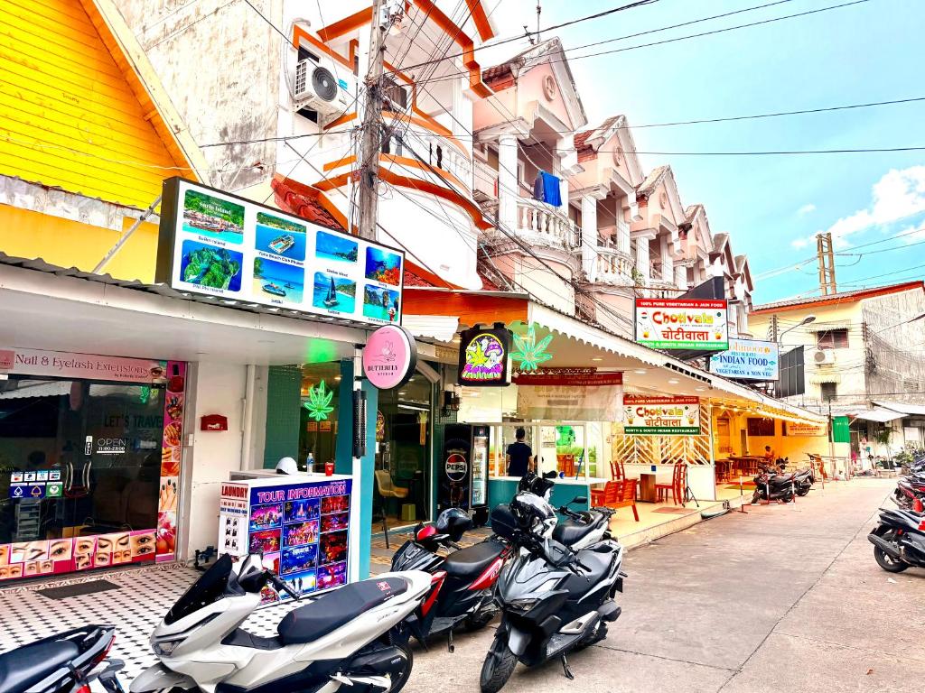 a group of motorcycles parked in front of a building at Vista Inn Patong in Patong Beach