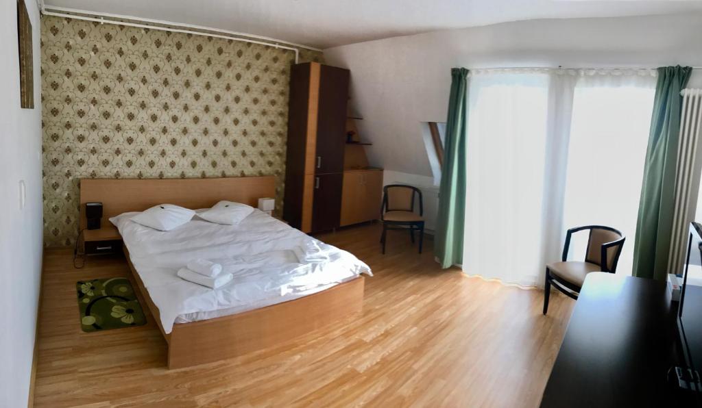 Postel nebo postele na pokoji v ubytování ApartHotel Zorilor