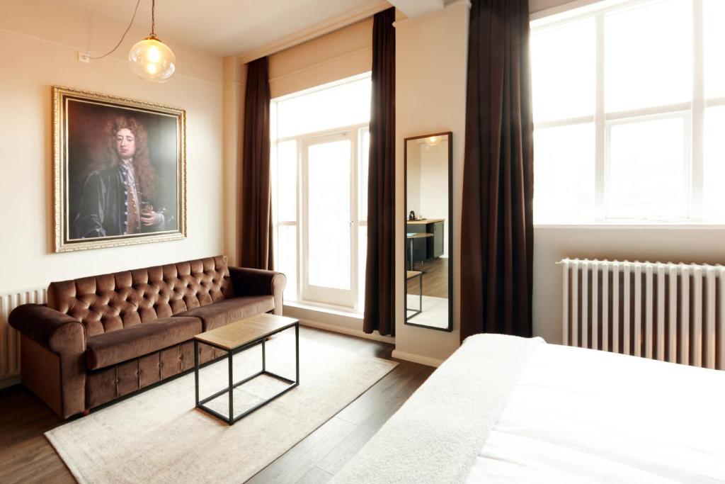 Postel nebo postele na pokoji v ubytování Fosshotel Baron