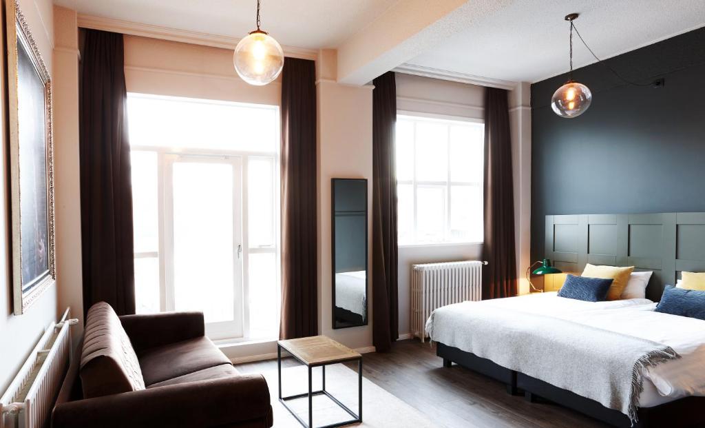 Postel nebo postele na pokoji v ubytování Fosshotel Baron