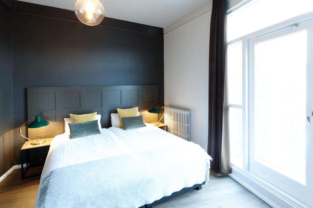 Postel nebo postele na pokoji v ubytování Fosshotel Baron