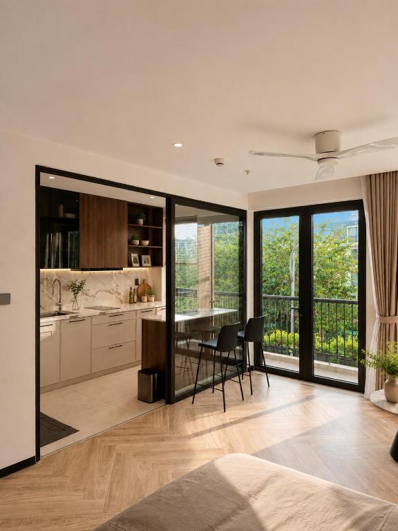 a kitchen and dining room with a table and chairs at AMA Residences in Buon Ma Thuot