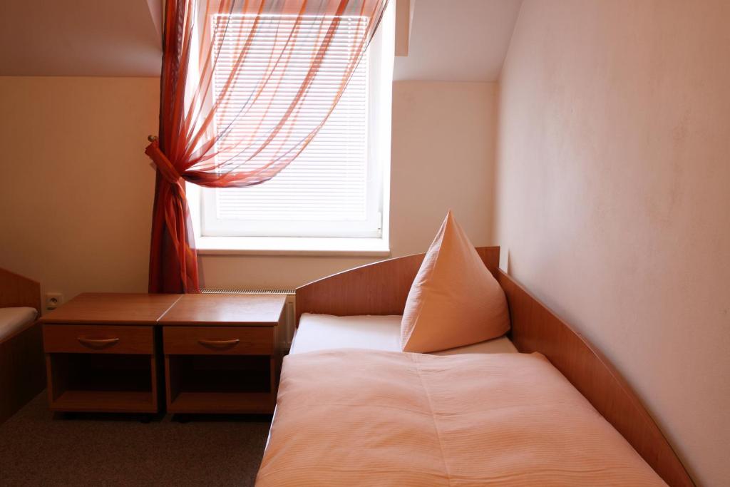 Postel nebo postele na pokoji v ubytování Hotel Solitaire