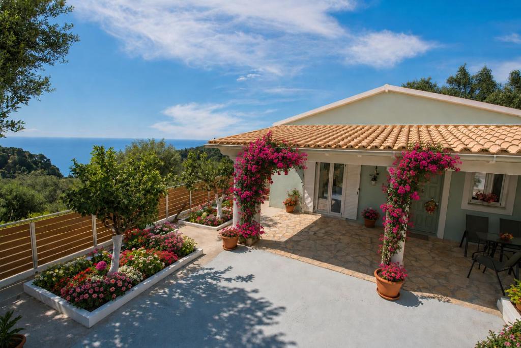 a house with flowers in front of it at Monopoli home in Glyfada