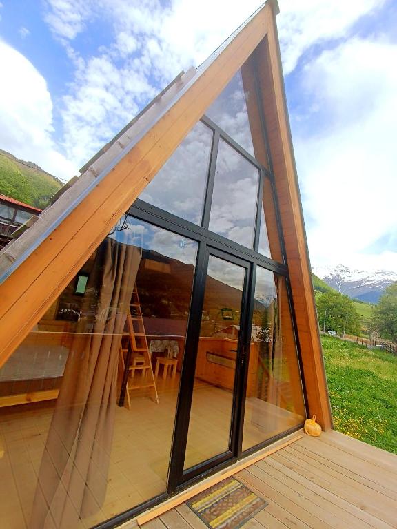 a large sliding glass door on a house at Hochaladah2 in Mestia