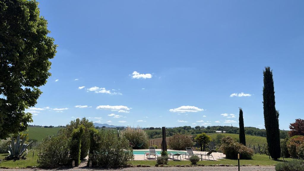 a view of a garden with trees and a pool at Villa Nardelli in Pozzuolo