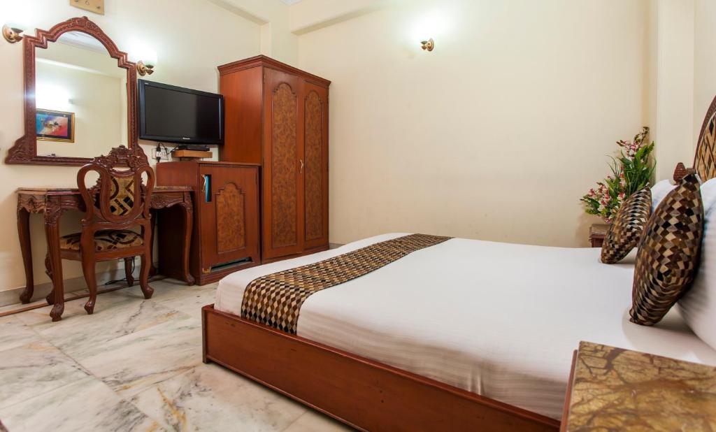 Postel nebo postele na pokoji v ubytování Hotel Sunstar Residency