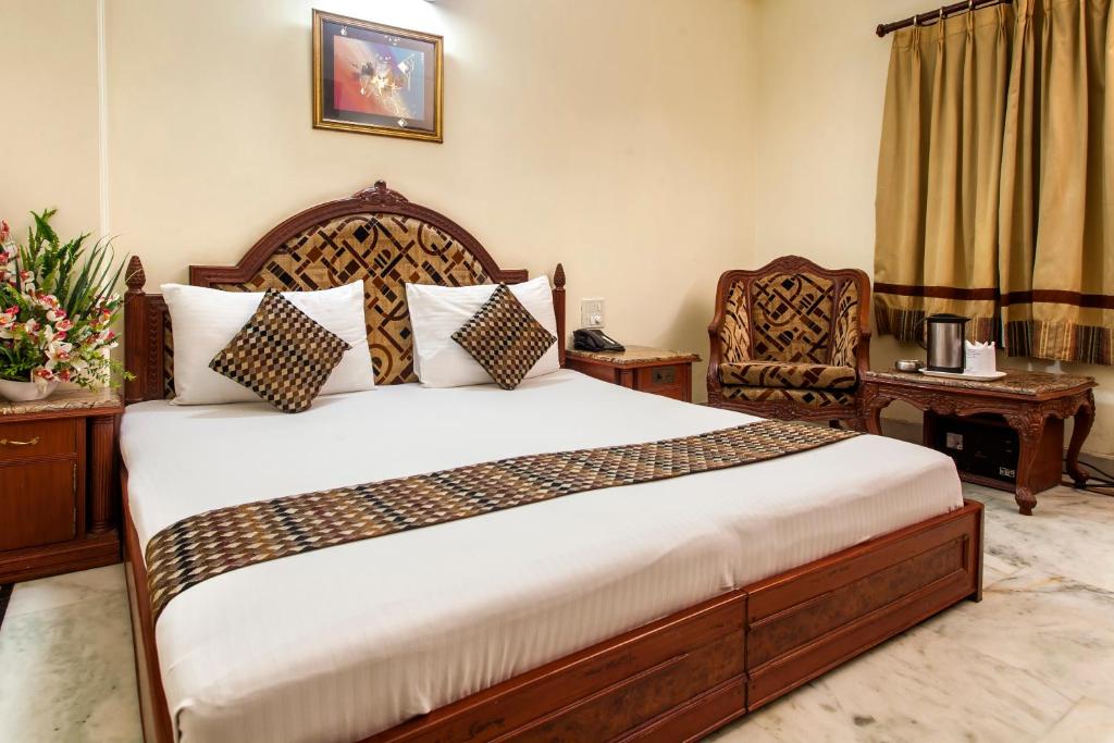 Postel nebo postele na pokoji v ubytování Hotel Sunstar Residency