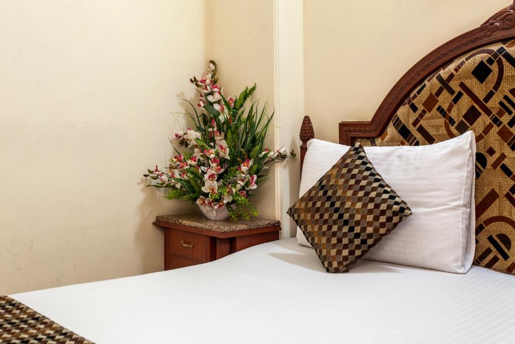 Postel nebo postele na pokoji v ubytování Hotel Sunstar Residency
