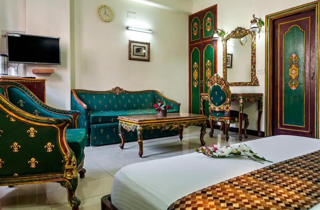 TV a/nebo společenská místnost v ubytování Hotel Sunstar Residency