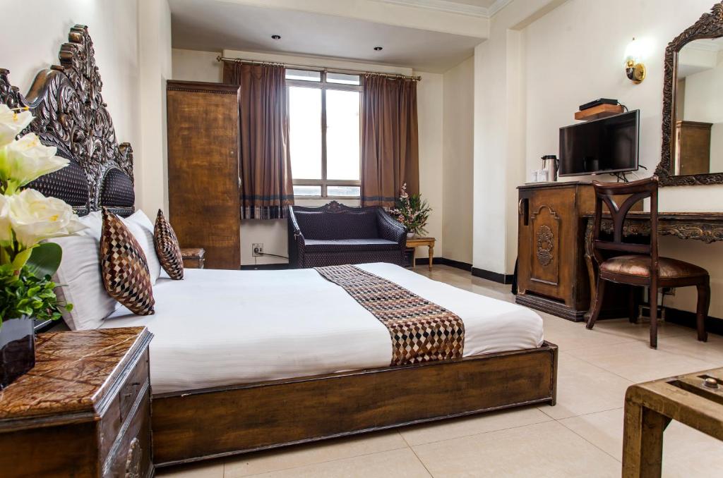 Postel nebo postele na pokoji v ubytování Hotel Sunstar Residency