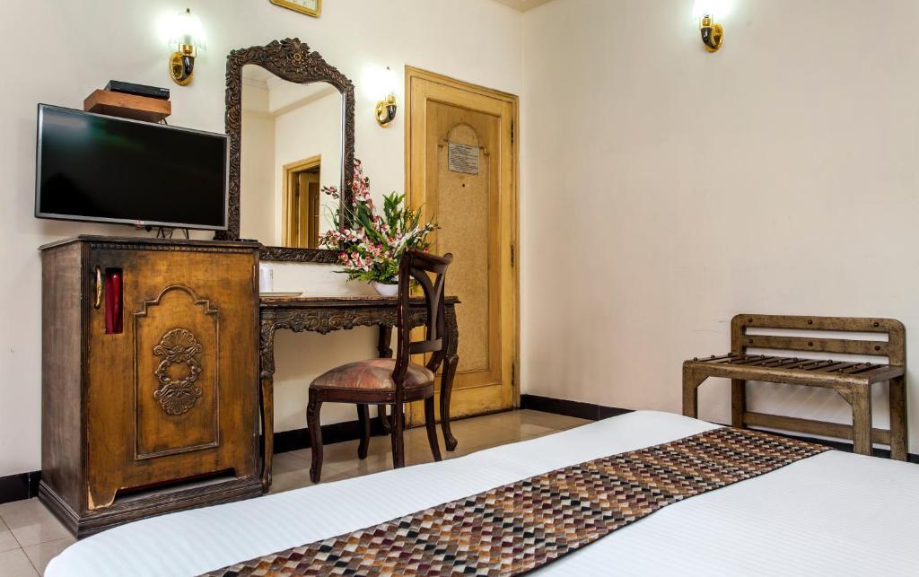 Postel nebo postele na pokoji v ubytování Hotel Sunstar Residency