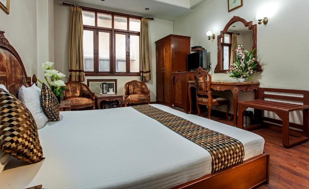 Postel nebo postele na pokoji v ubytování Hotel Sunstar Residency