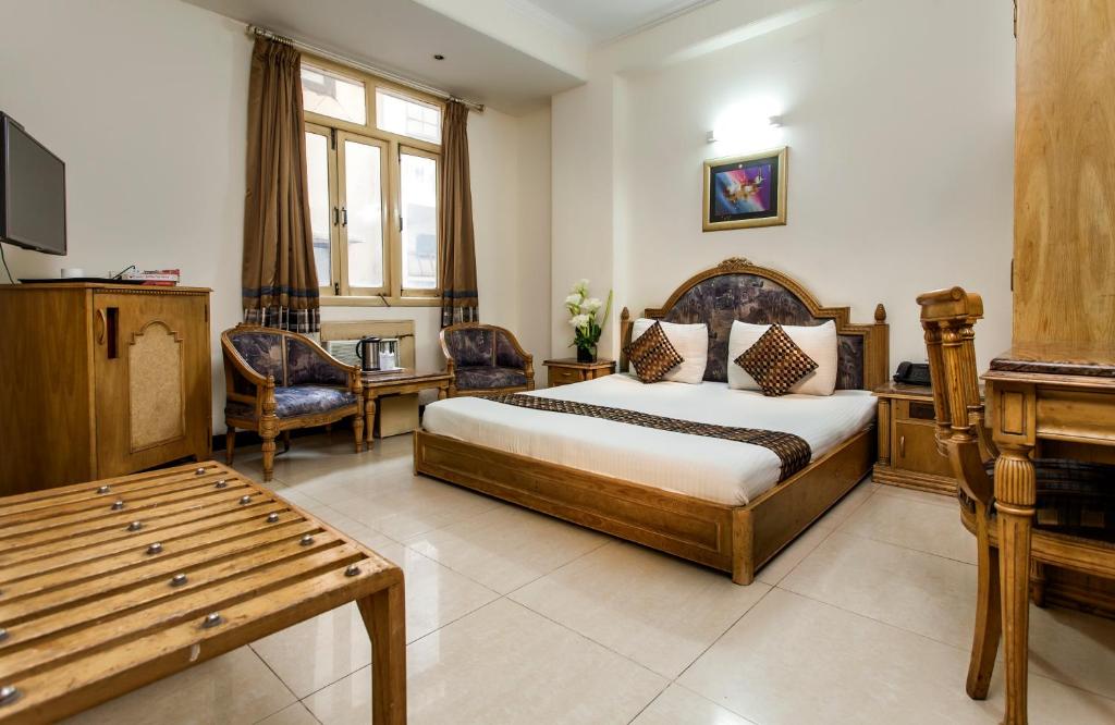 Postel nebo postele na pokoji v ubytování Hotel Sunstar Residency