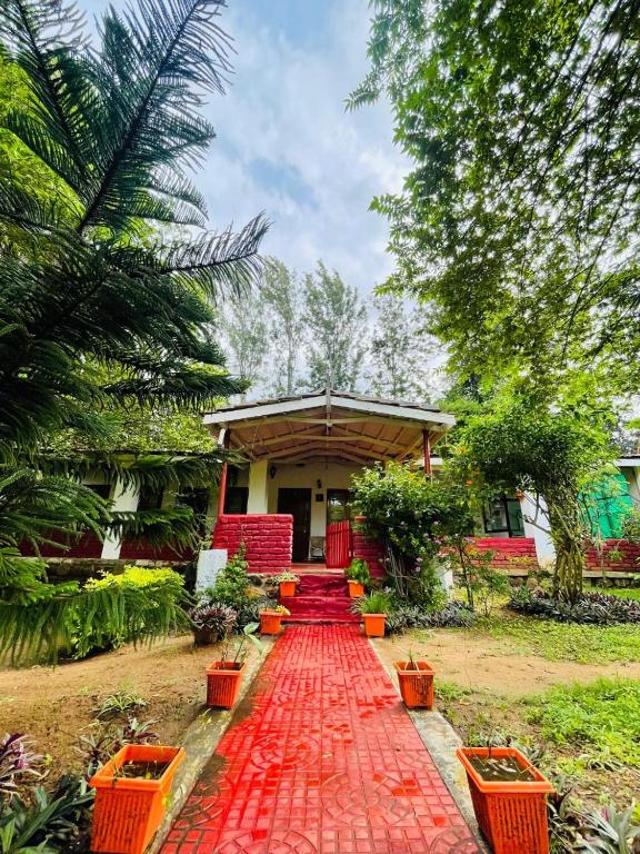 a red brick walkway in front of a house at Wild Valley Club in Masinagudi