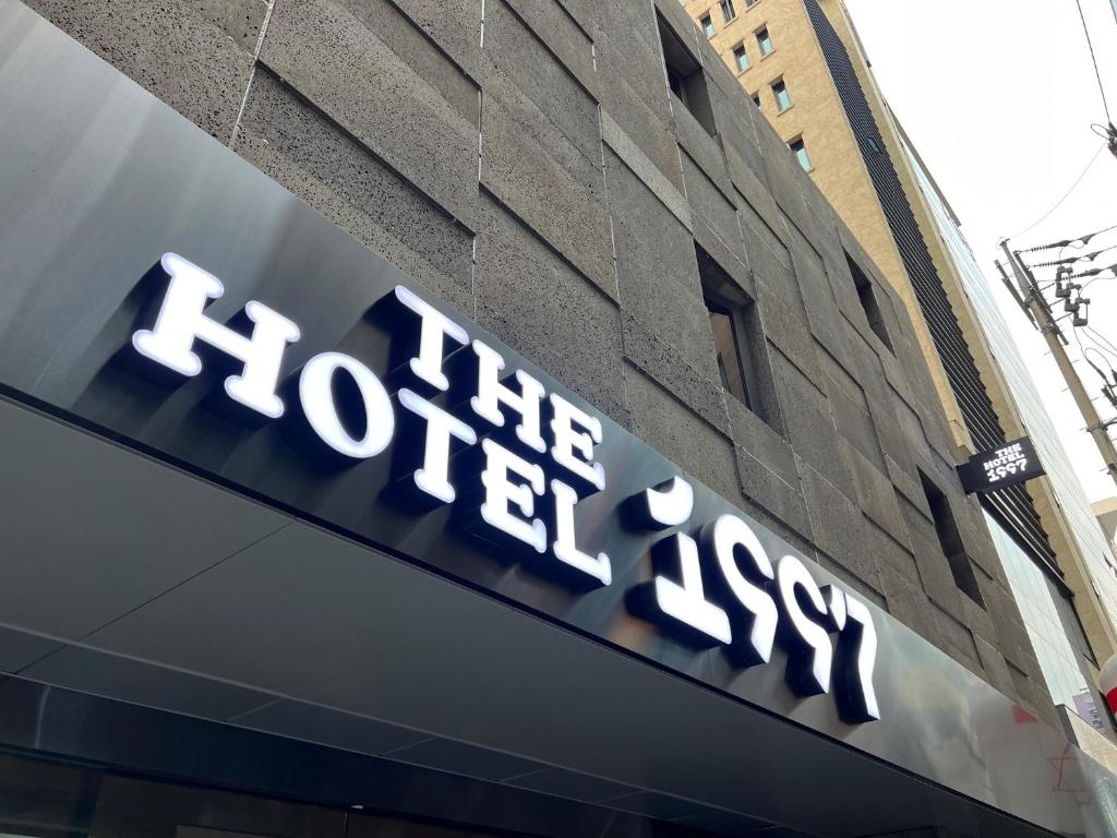 a sign on the side of a building at The hotel 1997 - 더호텔 1997 in Seoul