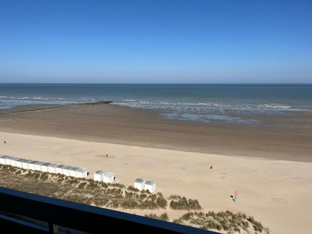 a view of a beach and the ocean at Studio Zeester in Westende-Bad