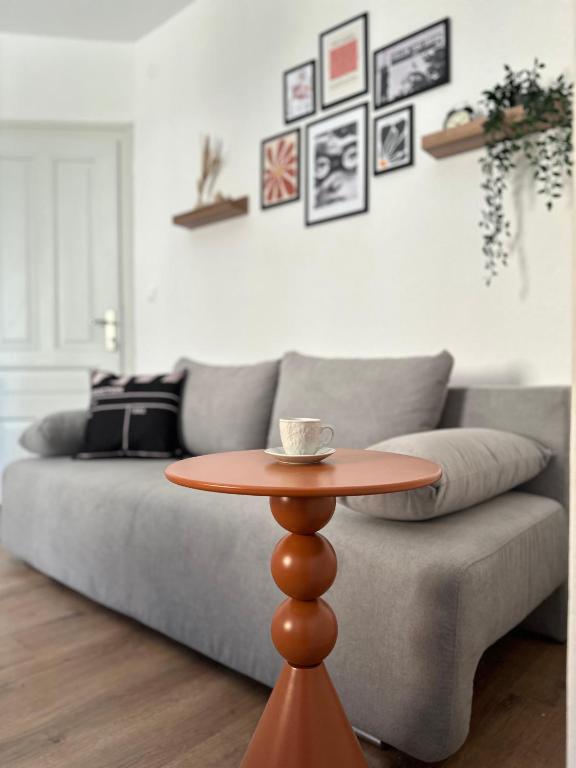 a coffee table in a living room with a couch at Legend Suites Bitola in Bitola
