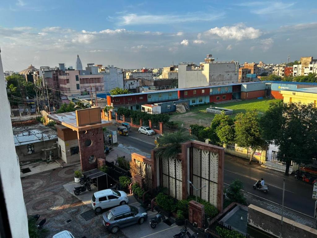 a view of a city with cars parked in a parking lot at RADHEY RADHEY stays in Vrindāvan