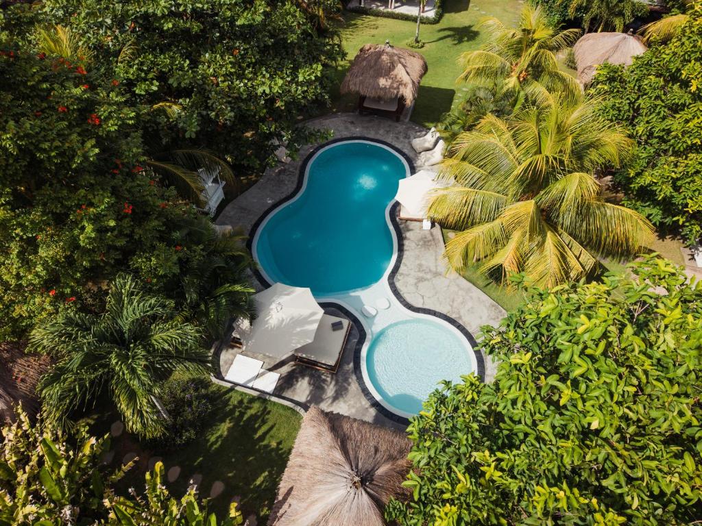 an overhead view of a swimming pool at a resort at Village Bali in Uluwatu