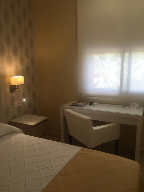 Postel nebo postele na pokoji v ubytování Hotel Felix