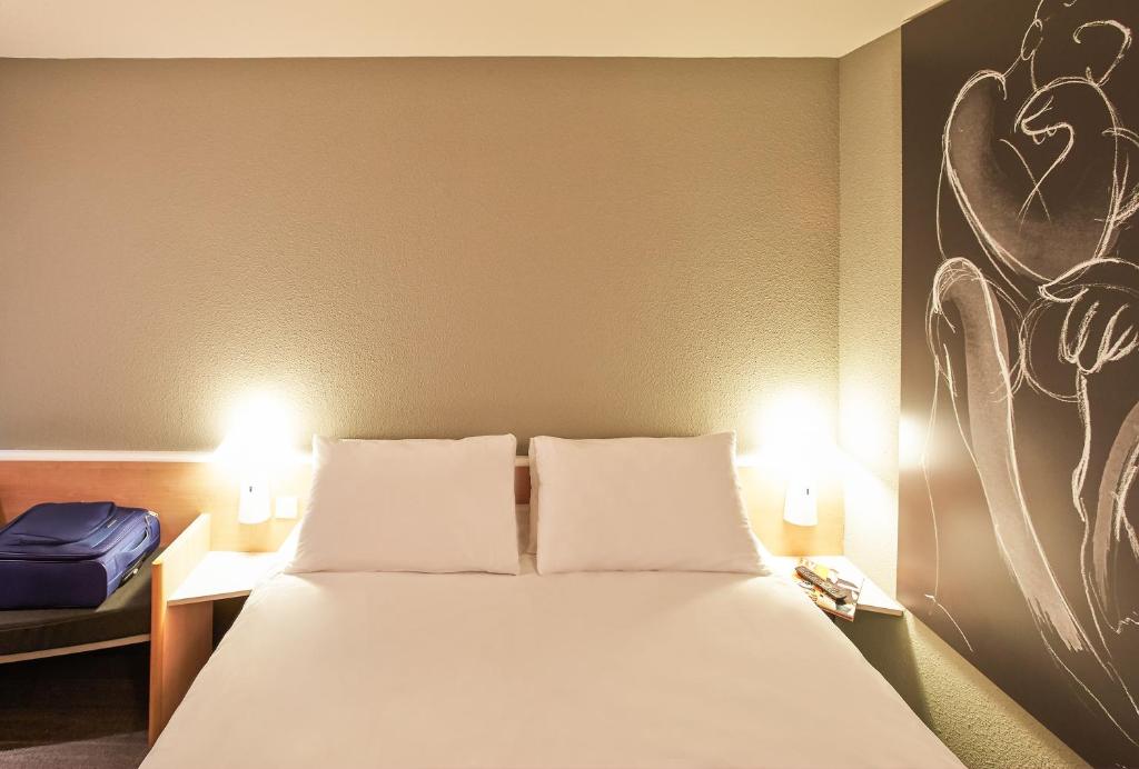 Postel nebo postele na pokoji v ubytování ibis Mulhouse Ile Napoleon