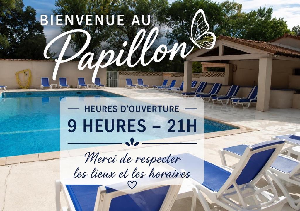 a sign by a swimming pool with chairs and a butterfly at La maison papillons in Quissac