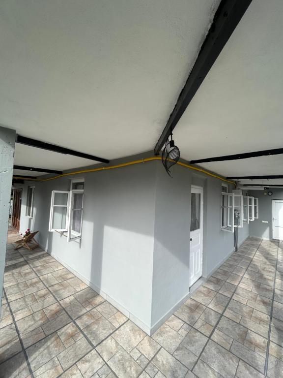 a white wall with a yellow line on it at Davitis Vila in Chakvi