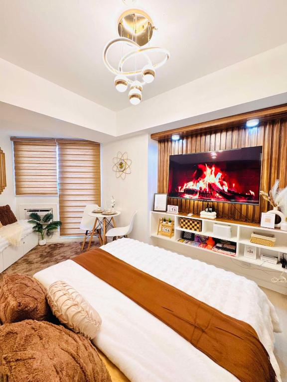a bedroom with a large bed with a large fireplace at Terracotta Azure in San Fernando