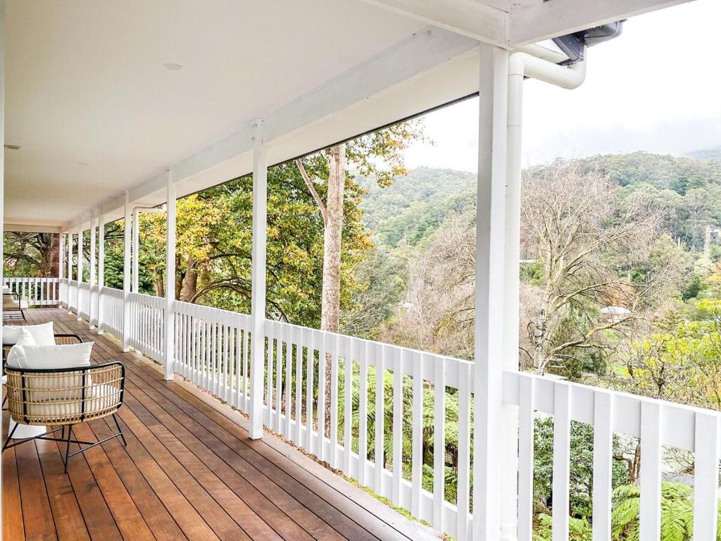 a porch with a view of the mountains at Martyr Views in Warburton