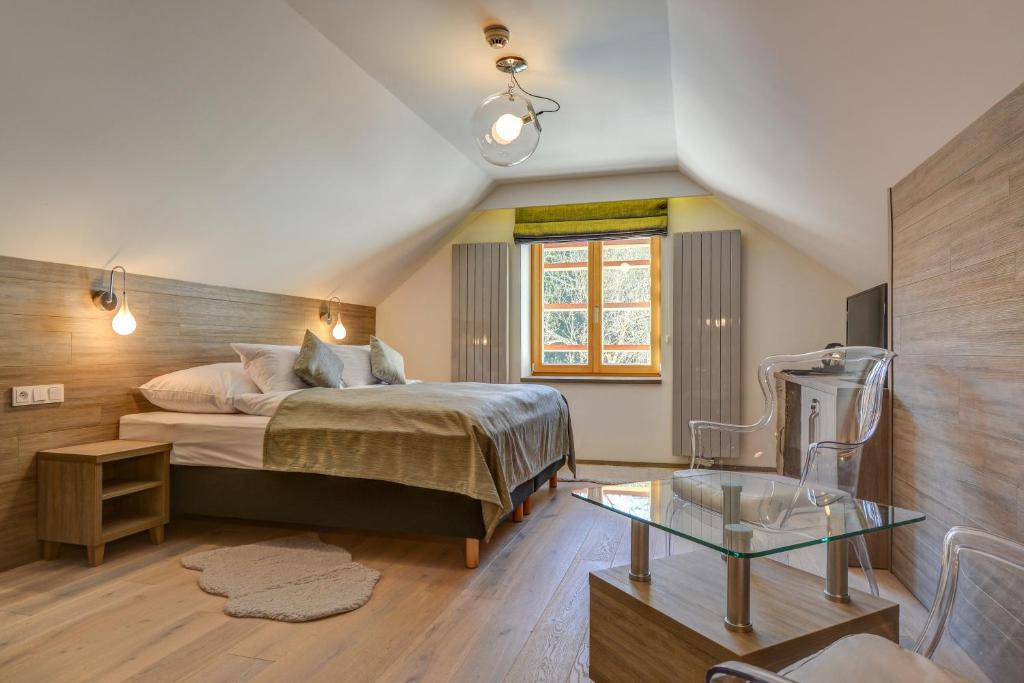 Postel nebo postele na pokoji v ubytování Amenity Hotel & Resort Špindlerův Mlýn