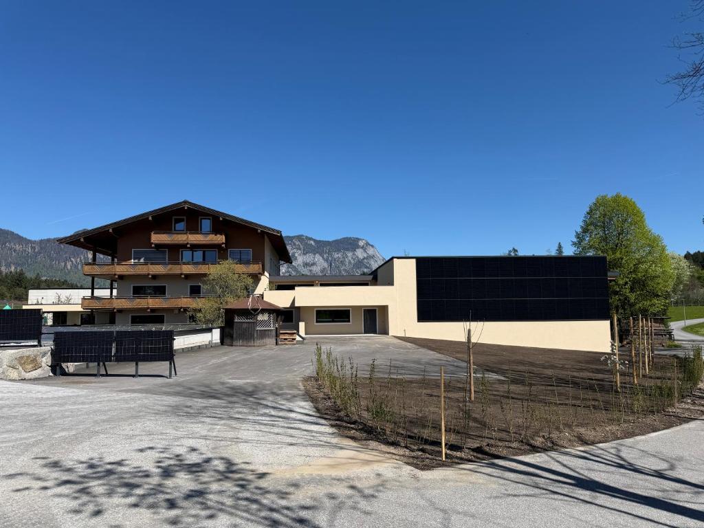 a large building with a fence in front of it at Häringer Mühle in Bad Häring