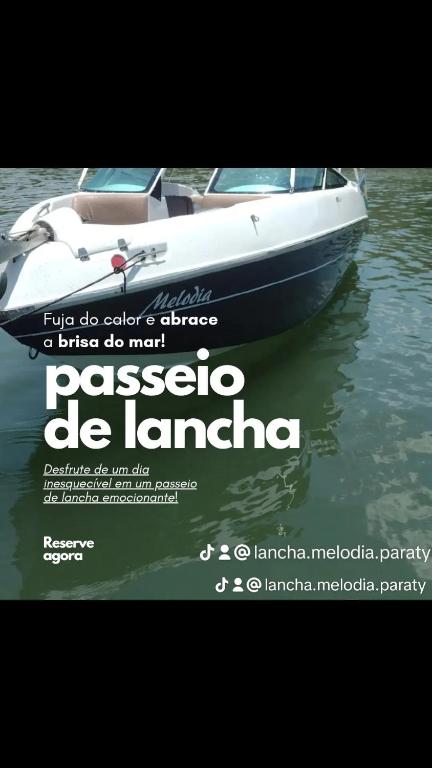 a poster of a boat in the water at Lancha melodia in Paraty