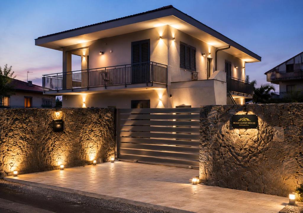 a house with lights in front of it at Reale Guest House in Mascalucia