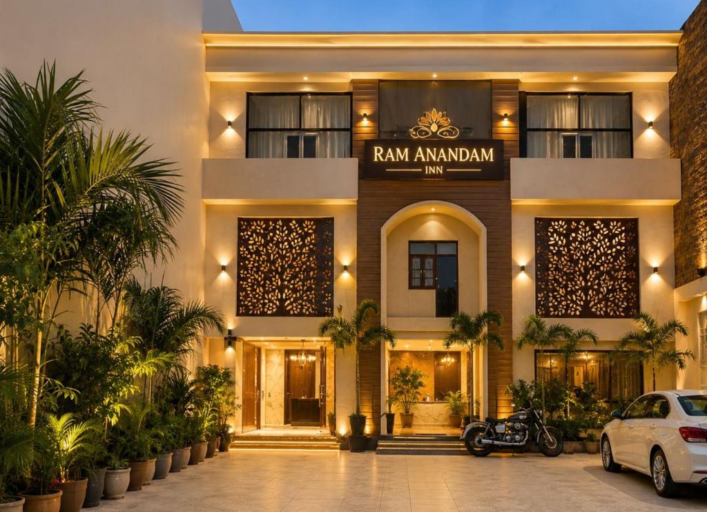 a building with a motorcycle parked in front of it at Ram Anandam inn in Ayodhya