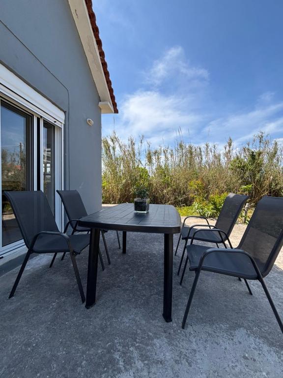 a table and chairs sitting on a patio at Modern Villa in Lesvos in Apidias Lakos