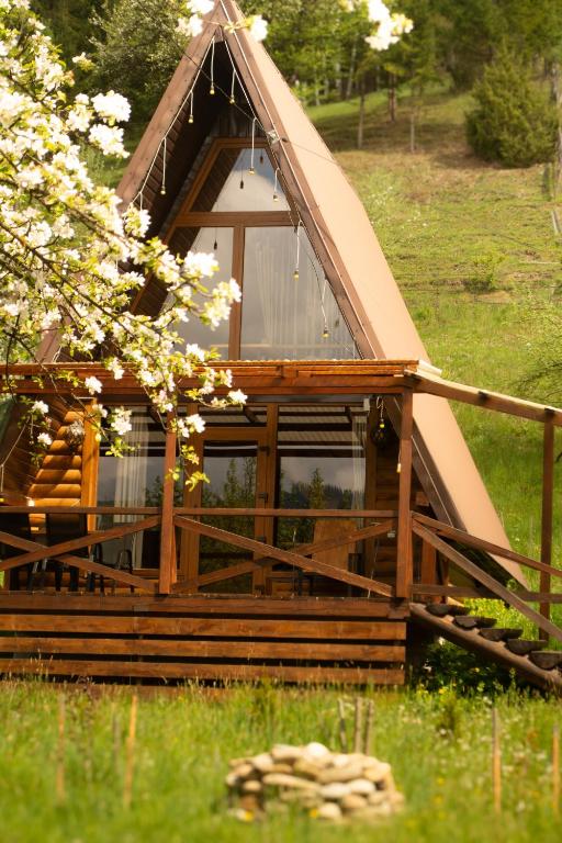 a wooden cabin with a thatched roof at Sadyba Lileya in Verkhovyna