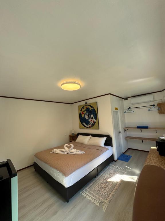 a bedroom with a large bed in a room at Blue Privacy Resort in Nathon Bay