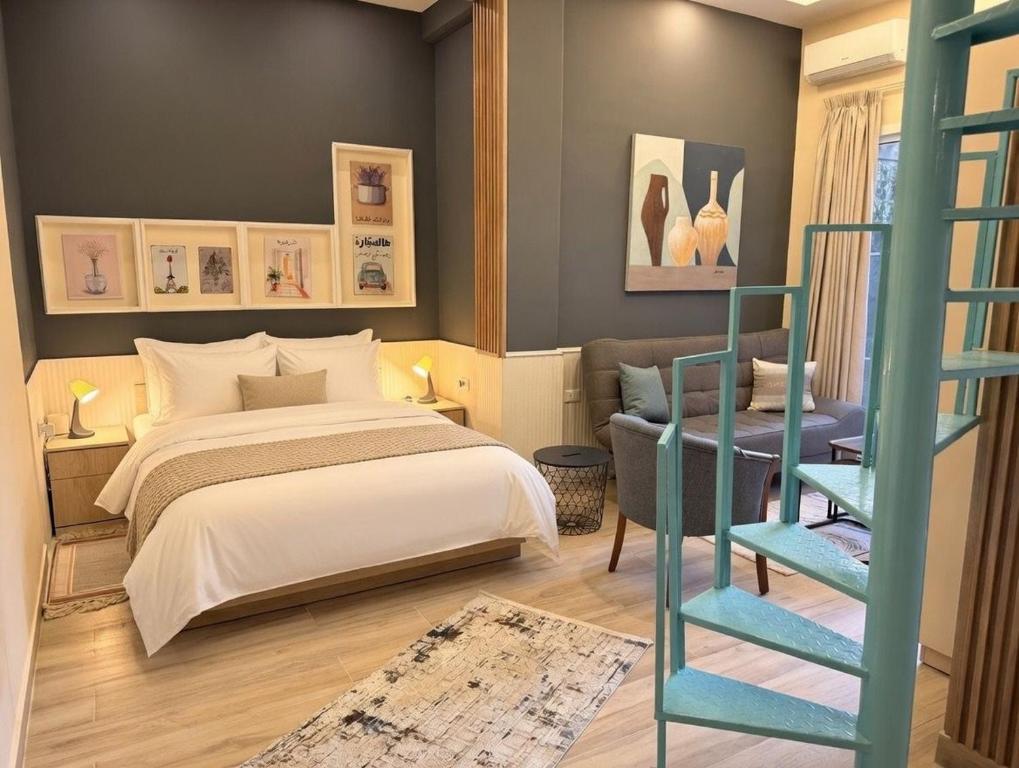 a bedroom with a bed and a blue ladder at Ya Bayté in Beirut