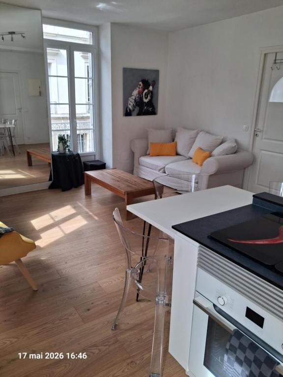 a living room with a couch and a table at appartement centre ville in Souillac