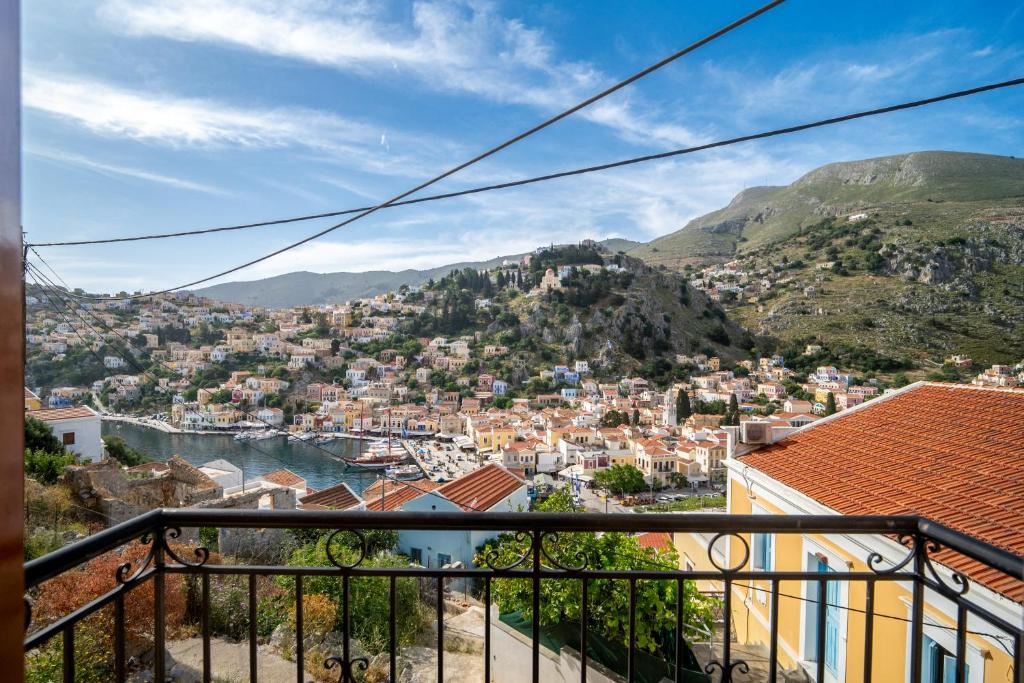 a view of a city from a balcony at Panoramic View House in Symi