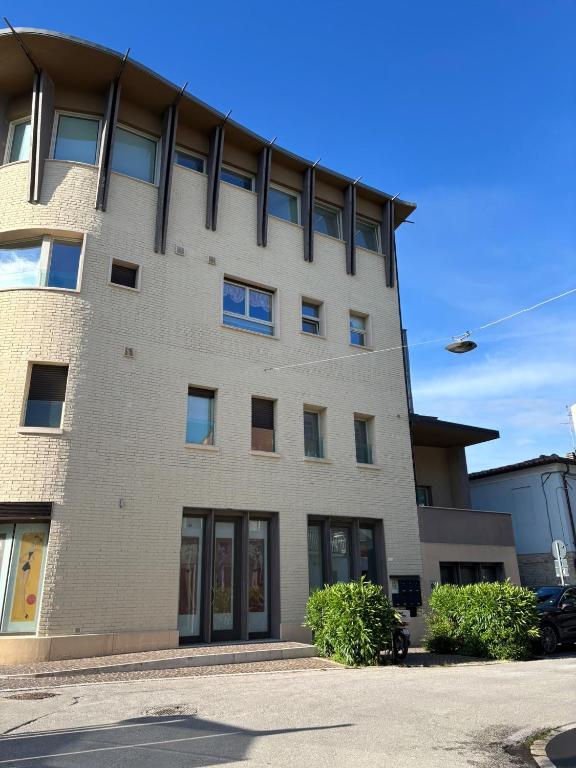 a large brick building with windows at Residence Fortuna - Appartamento Gori in Fano